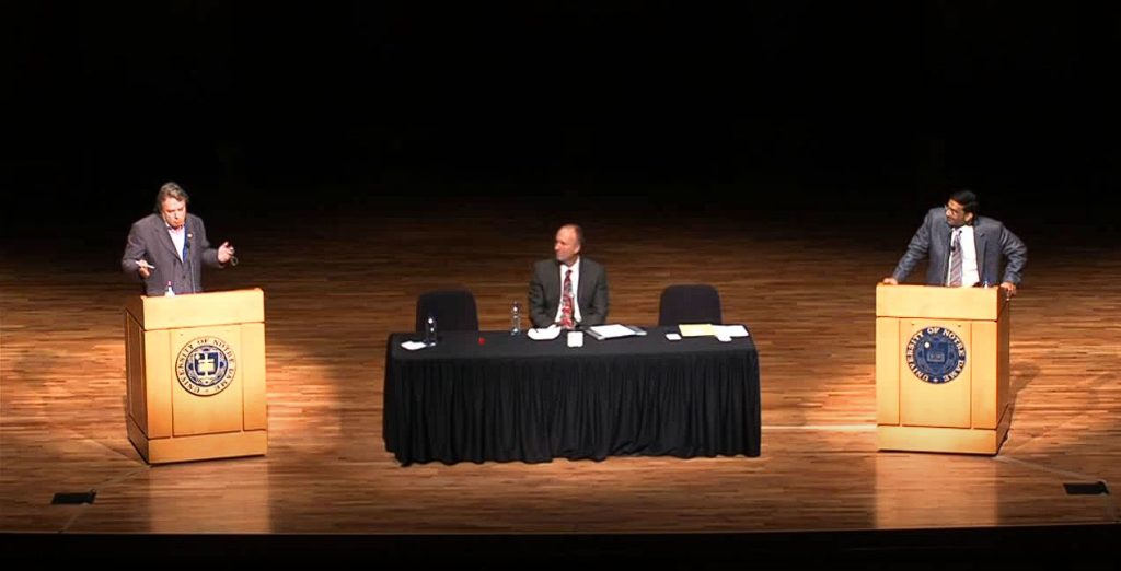 Christopher Hitchens on stage with Dinesh D'Souza